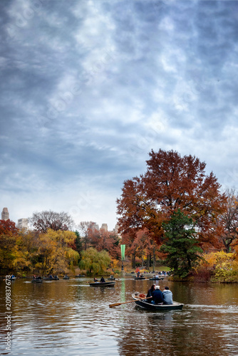 Cloudy autumn day at The Lake in Central Park, New York, New York.