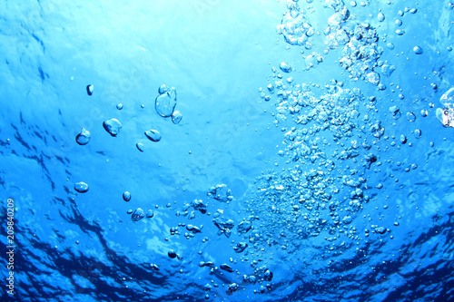 Underwater bubbles in blue water 