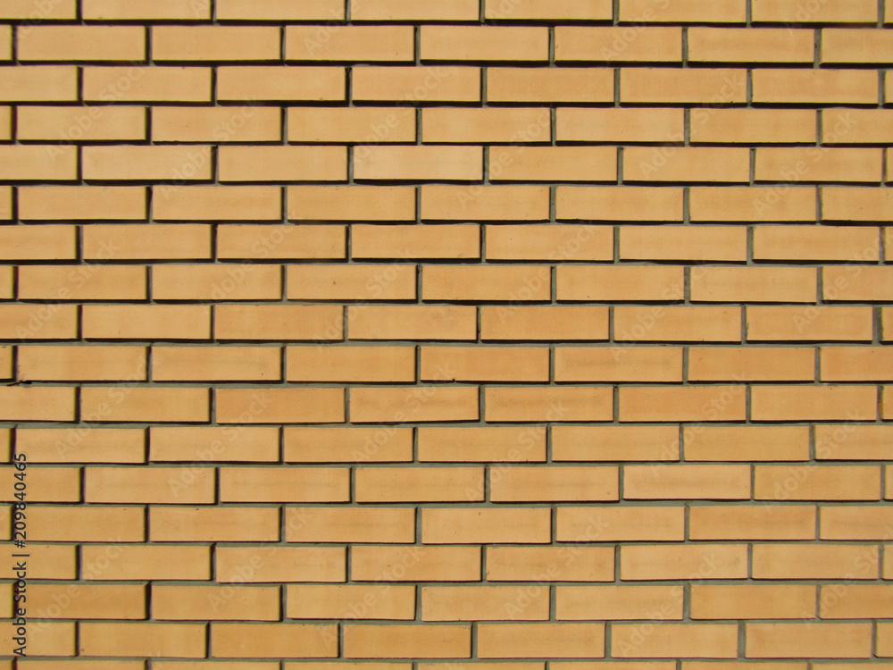 Brick yellow wall/ Brick yellow wall for building houses and fences and suitable for any texture and decoration of buildings Brick yellow wall/ Brick yellow wall for building houses and fences and suitable for any texture and decoration of buildings