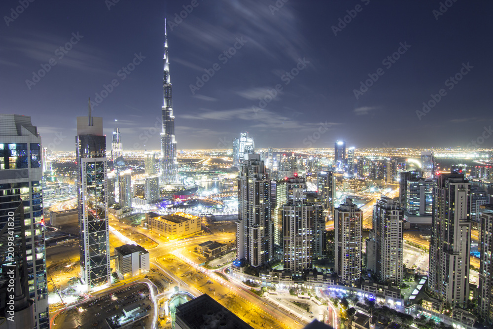 Fototapeta premium World longest building Burj Khalifa with Dubai Downtown Towers Top View at night