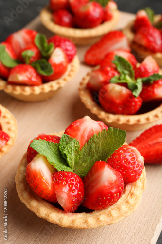 Ripe strawberries in tartlets