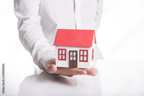 business salesman agent offer house. concept agreement contract sale home.