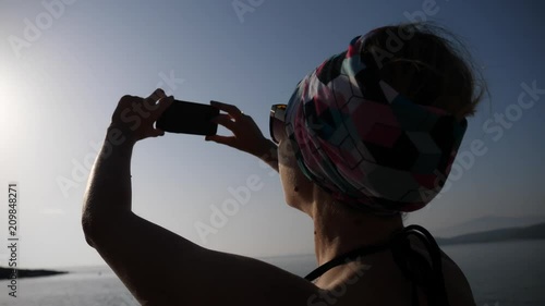 Young happy woman enjoy take selfie picture during summer sea beach leisure in Greece photo