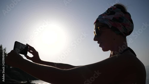 Young happy woman enjoy take selfie picture during summer sea beach leisure in Greece photo