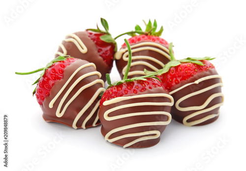 Delicious chocolate covered strawberries on white background