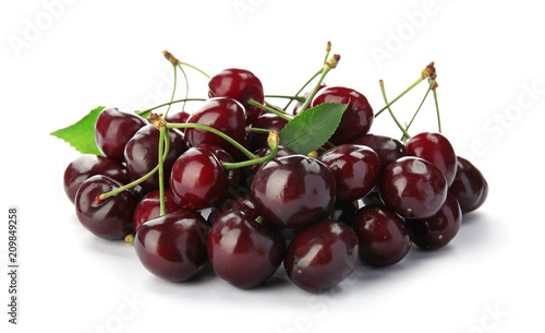 Sweet red cherries with leaves on white background
