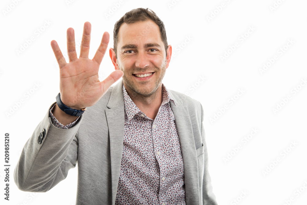 Portrait of business man showing number five Portrait of business man showing number five