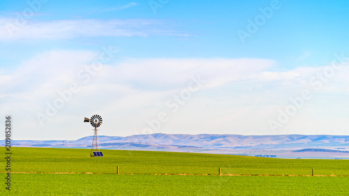 Old windmill with sloar batteries photo