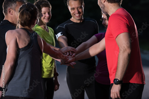 runners giving high five to each other