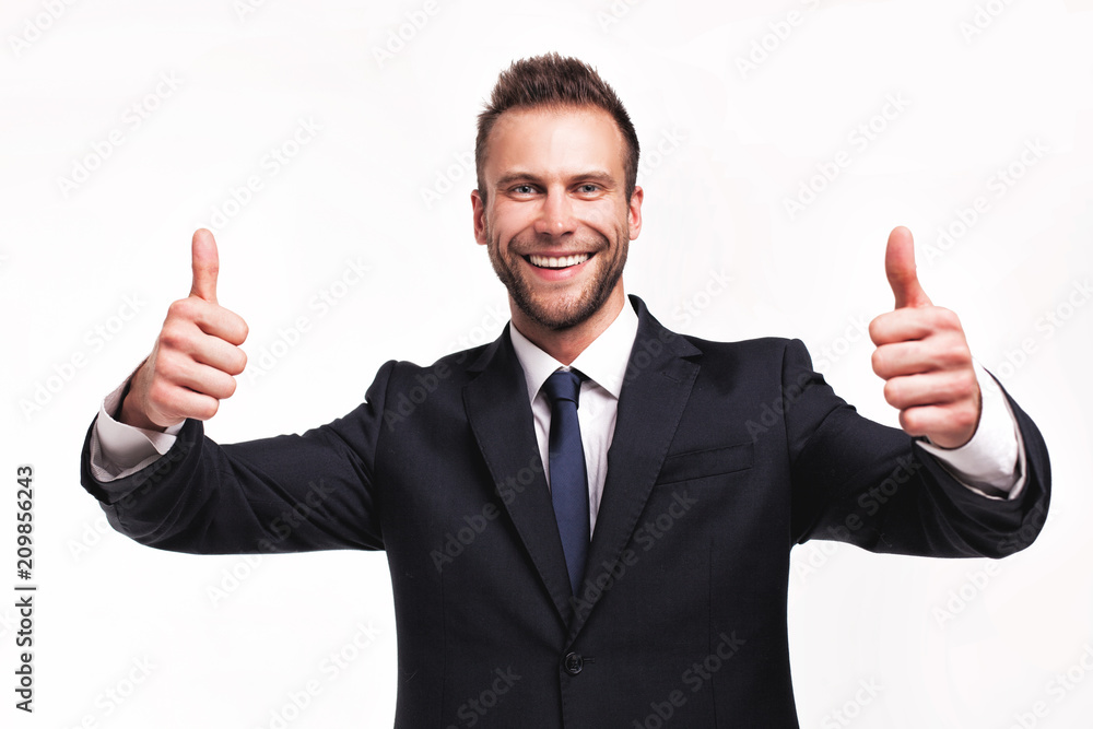 businessman showing thumbs up gesture businessman showing thumbs up gesture