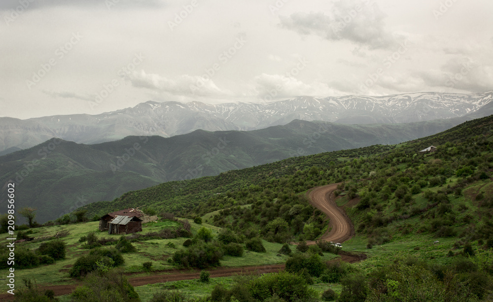 A road passing through a Green Landscape in Mazandaran , Iran .