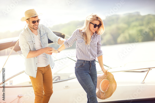 Rich couple, luxury vacation, sailing the sea