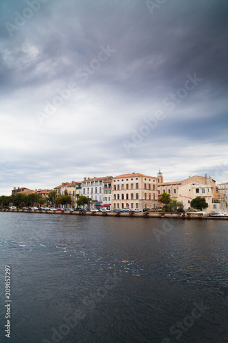 Canal in Venice and black rain clouds