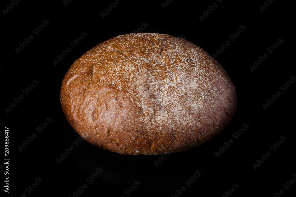 Bread on a dark background.Loaf Bread on a dark background.Loaf