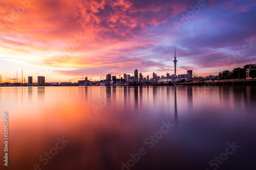 Sun rising over Auckland city, city scape, silhouette, New Zealand photo