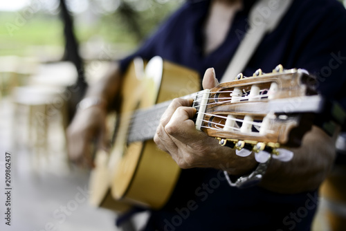 Canvas Print closeup detail hand playing folk guitar outdoor summer festival
