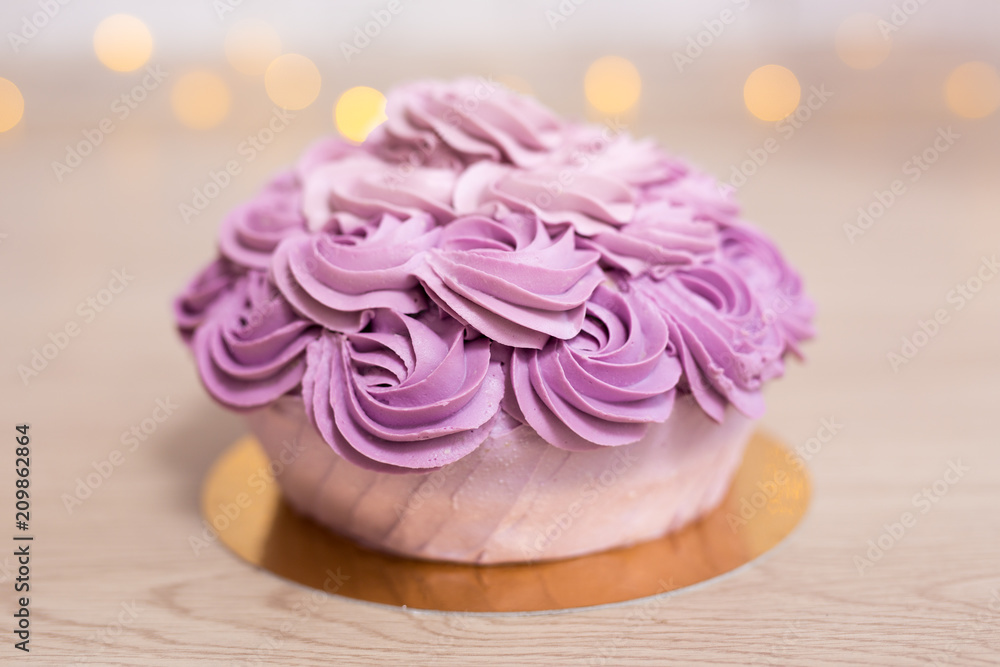 birthday concept - purple cake over wooden background birthday concept - purple cake over wooden background