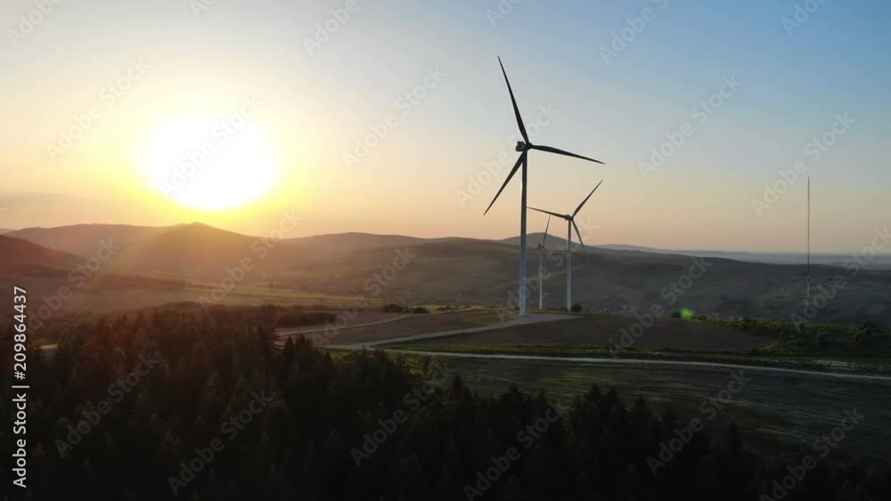 wind turbines at sunset convertation green energy panoramic aerial view environment pollution problems human being eco-system technology bright sun light rising future of planet Earth new generation wind turbines at sunset convertation green energy panoramic aerial view environment pollution problems human being eco-system technology bright sun light rising future of planet Earth new generation