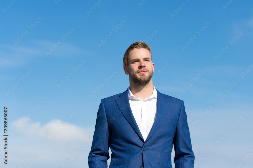 Businessman successful entrepreneur in suit walks outdoor sunny day, sky background. Man confident and well groomed enjoy freedom. Businessman attractive appearance looks successful. Freedom concept Businessman successful entrepreneur in suit walks outdoor sunny day, sky background. Man confident and well groomed enjoy freedom. Businessman attractive appearance looks successful. Freedom concept