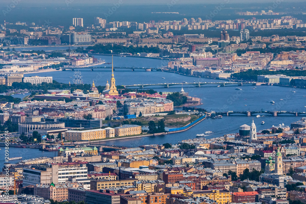 Obraz premium Saint Petersburg. Russia. View of the Peter and Paul Fortress from the side of Vasilievsky Island. City Center Petersburg. Bridges in St. Petersburg. Embankment of the Neva River.