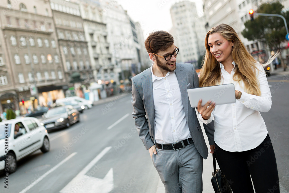 Business people talking outdoors Business people talking outdoors