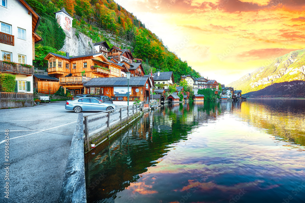 Classic postcard view of famous Hallstatt lakeside town reflecting in Hallstattersee lake in the Austrian Alps
