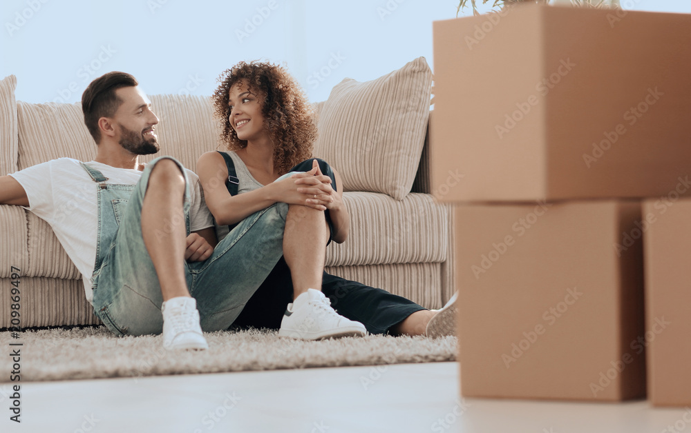 Happy family plans its future in a new home. Happy family plans its future in a new home.