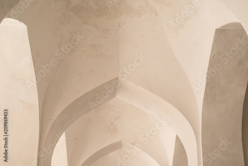 White arches and arches of the corridor in Kalyan mosque. Ancient buildings of medieval Asia. Bukhara, Uzbekistan