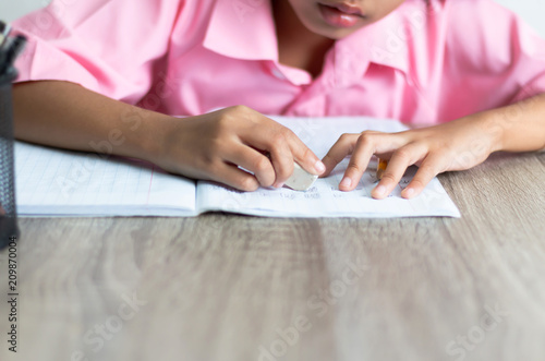 Children use a eraser is deleting word