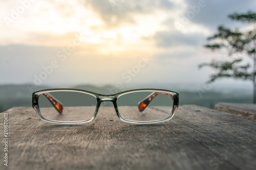 Eyeglasses on wooden table © sihasakprachum