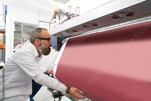 Espertise man in transfer printing industry plotter photo