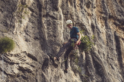 A Man Climbing a Rock