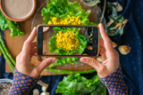 Smartphone food photo of bulgur wheat with turmeric powder, garlic and spices Phone lunch or dinner photography. Social media or blogging concept