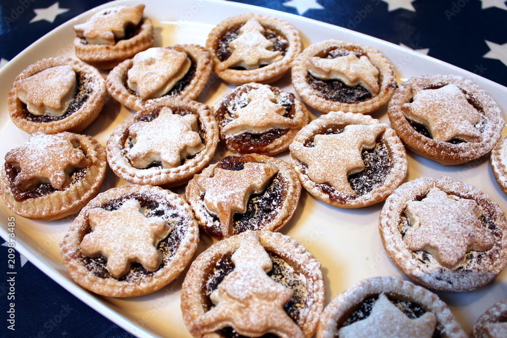 Home baked Christmas mince pies on a white tray