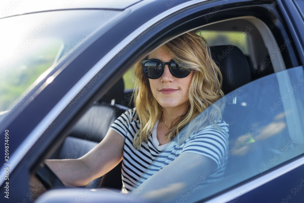 Naklejka premium Attractive blonde in the car.