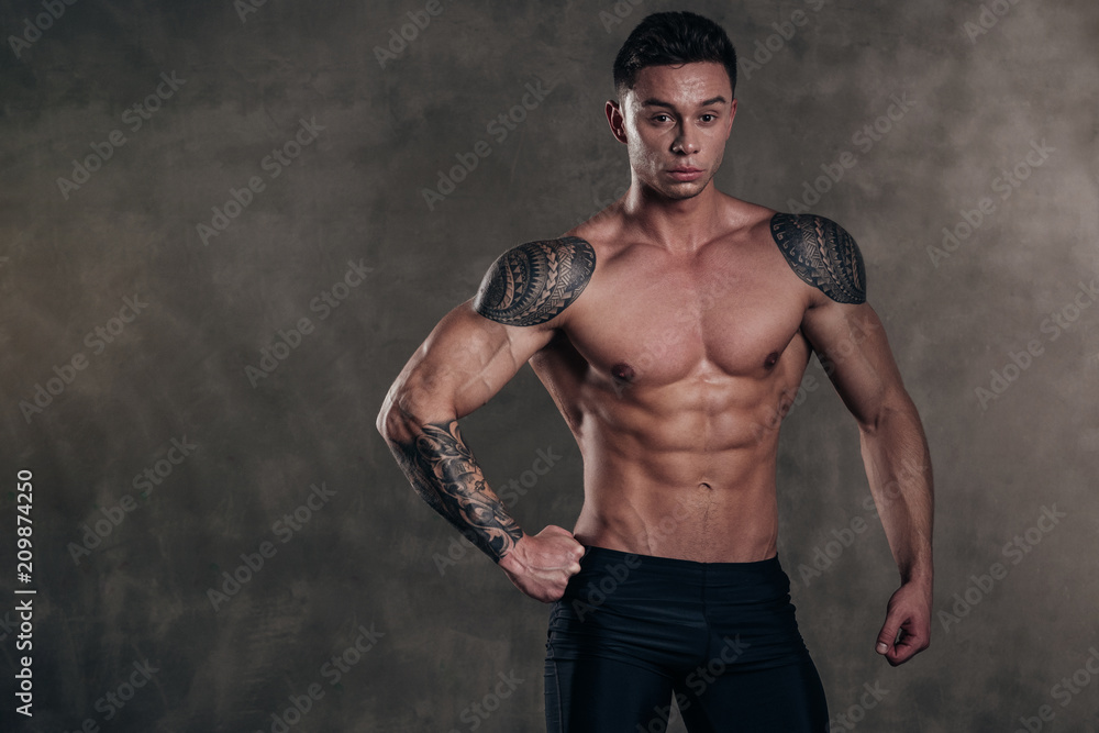 Studio Shot of a Stunning Hot Sporty Body of a Fitness Man with Perfect Forms