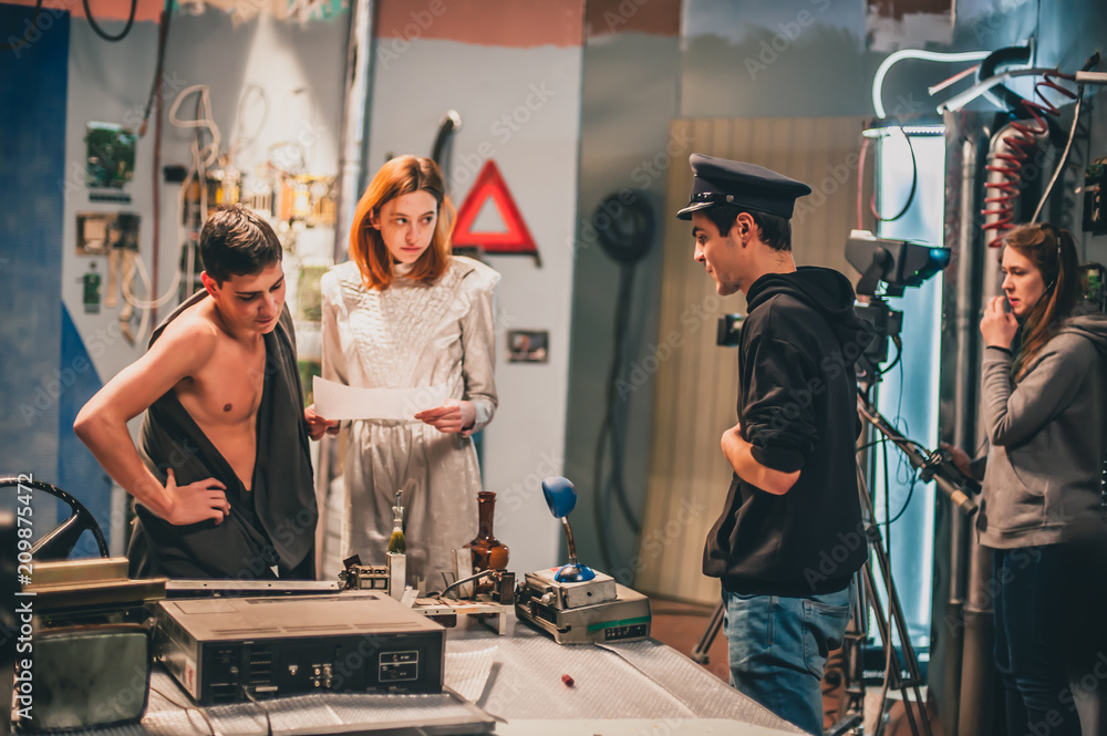 Fototapeta premium Behind the scene. Film crew filming movie scene in studio