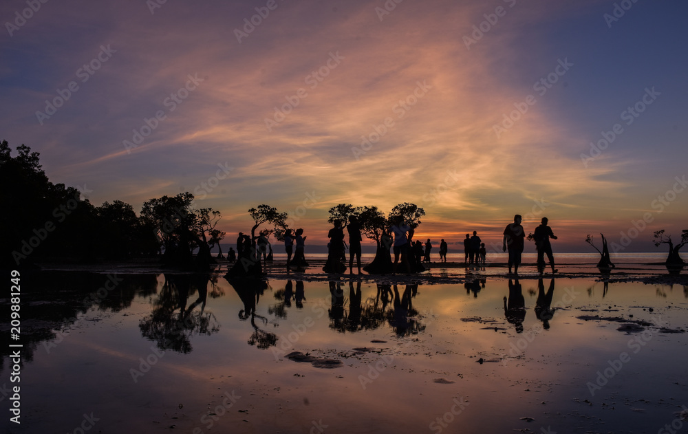 People enjoying evening, Mangrove in Walakiri Beach, after sunset, East Sumba, Indonesia