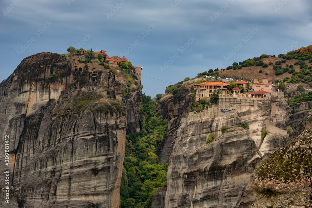 Magnificent autumn landscape.Beautiful view on the Holy Monasteries of Great Meteoron and Varlaam placed on edge of high rocks. Pindos Mountains, Thessaly, Greece, Europe