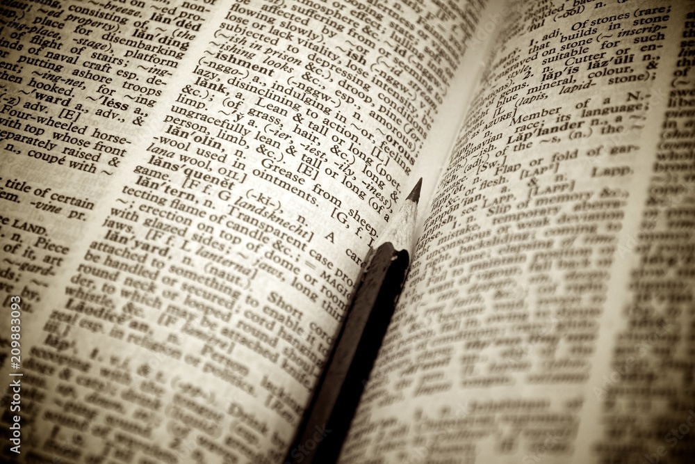 Fototapeta premium Black pencil on old book