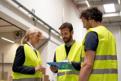 Managers checking the list of products