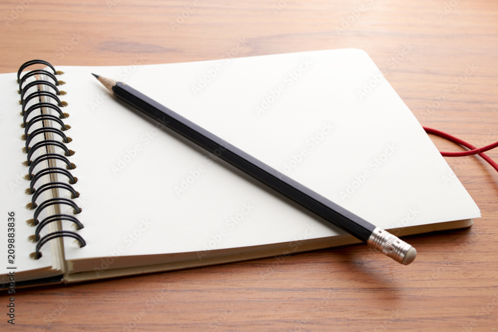 Writing on Notebook With Pencil Writing on Notebook With Pencil