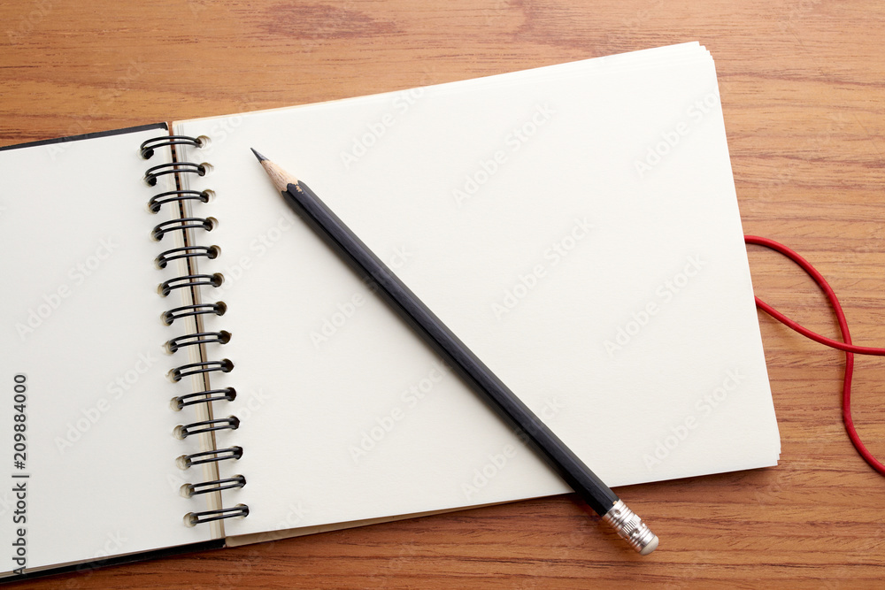 Writing on Notebook With Pencil Writing on Notebook With Pencil