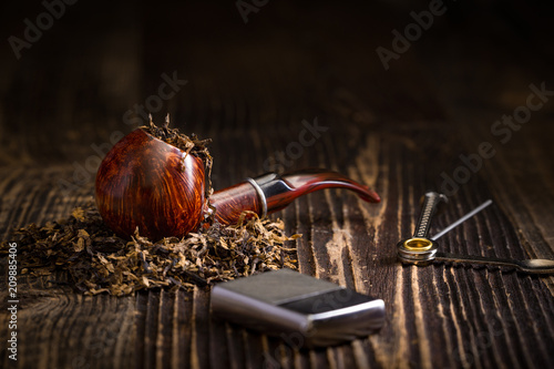 smoking pipe with tobacco leaves