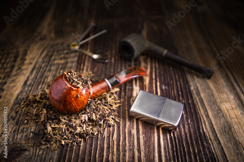 smoking pipe with tobacco leaves