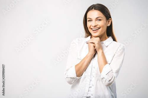 Wow! It's amazing news! It's wonderful I don't believe my eyes! Face portrait of smiling woman. Teeth smiling girl. One model portrait on white background.