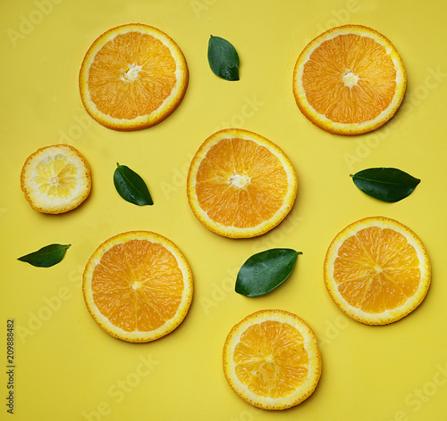 Orange Leaves Citrus Pattern on Yellow Background Minimal Flat Lay