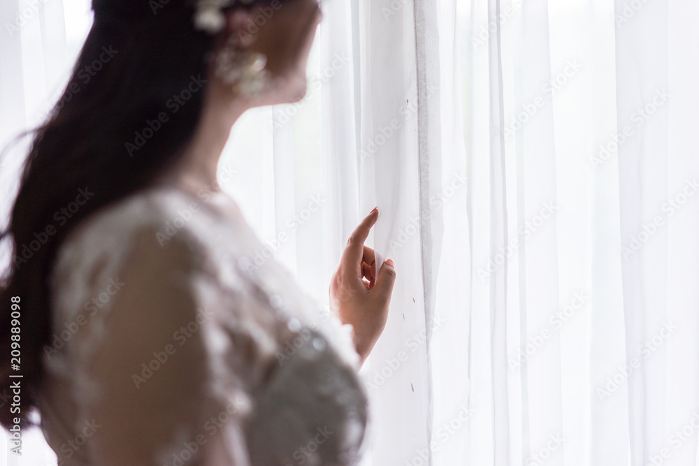 beautiful bride near window
