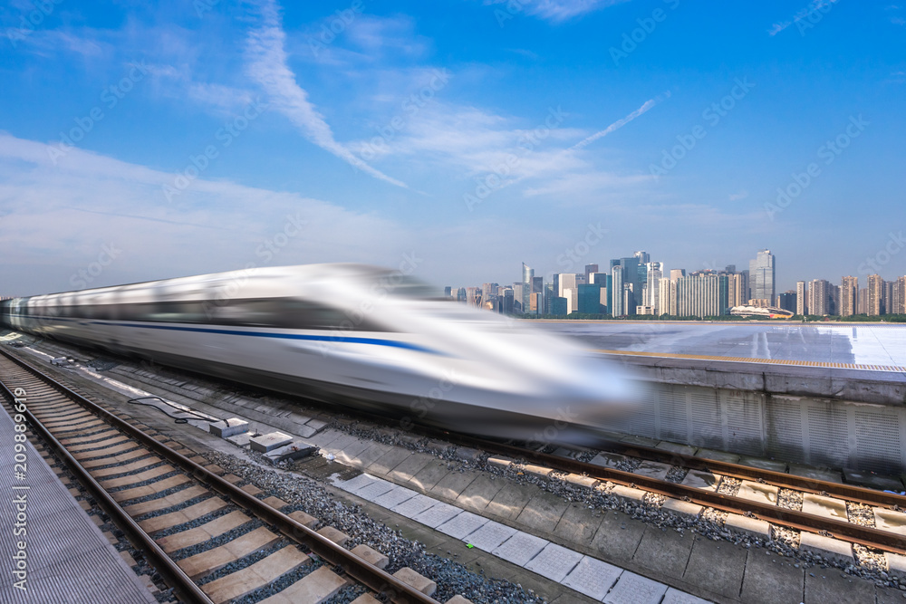 Naklejka premium high speed train with city skyline