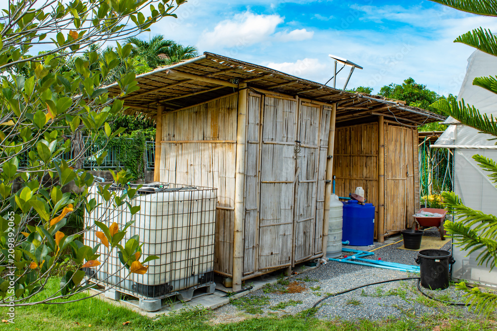 House built of bamboo in garden. House built of bamboo in garden.